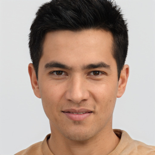 Joyful asian young-adult male with short  brown hair and brown eyes