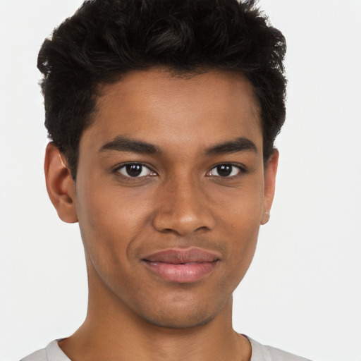 Joyful black young-adult male with short  brown hair and brown eyes