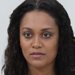 Neutral black young-adult female with long  brown hair and brown eyes