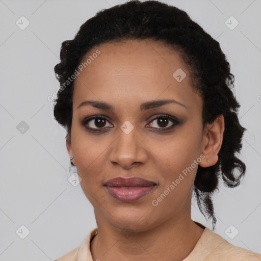 Joyful black young-adult female with short  black hair and brown eyes