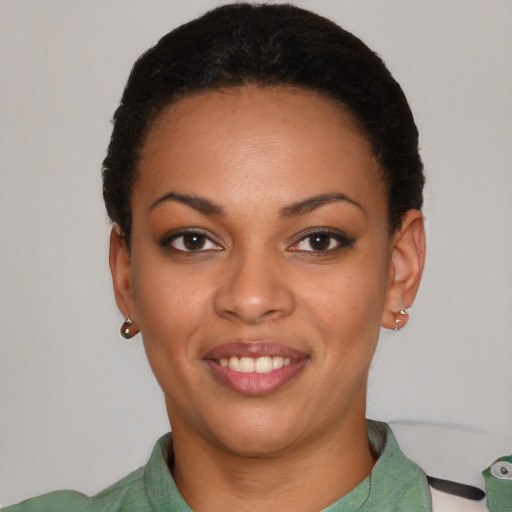 Joyful latino young-adult female with short  black hair and brown eyes