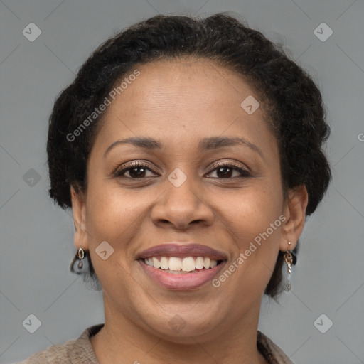 Joyful black adult female with short  brown hair and brown eyes