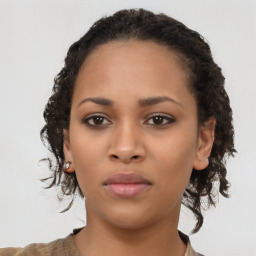 Neutral black young-adult female with medium  brown hair and brown eyes