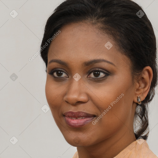 Joyful black young-adult female with short  brown hair and brown eyes