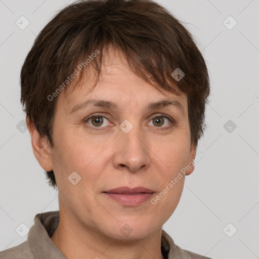 Joyful white adult female with short  brown hair and grey eyes