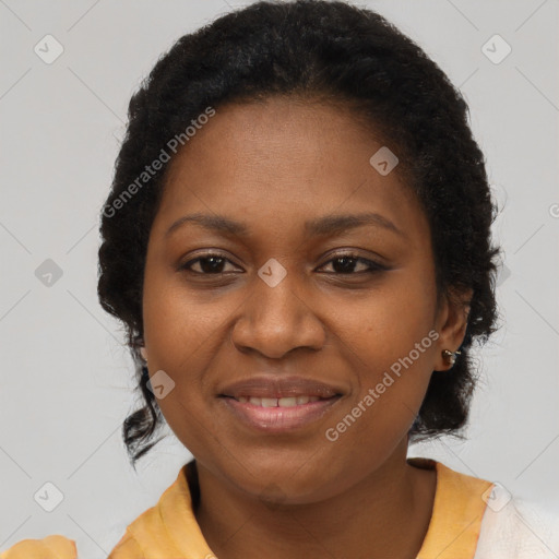 Joyful black adult female with short  brown hair and brown eyes