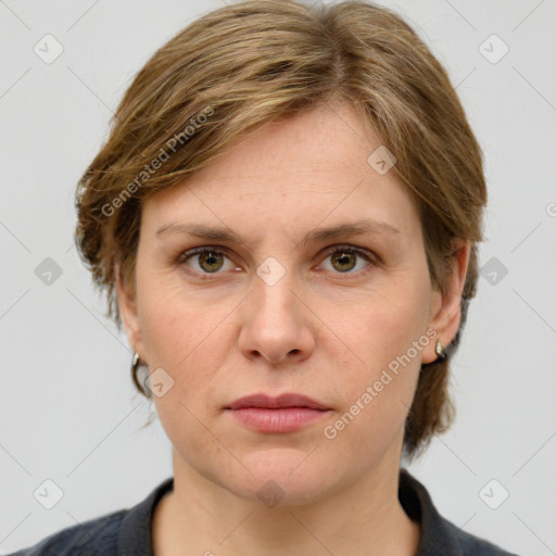 Joyful white adult female with medium  brown hair and grey eyes