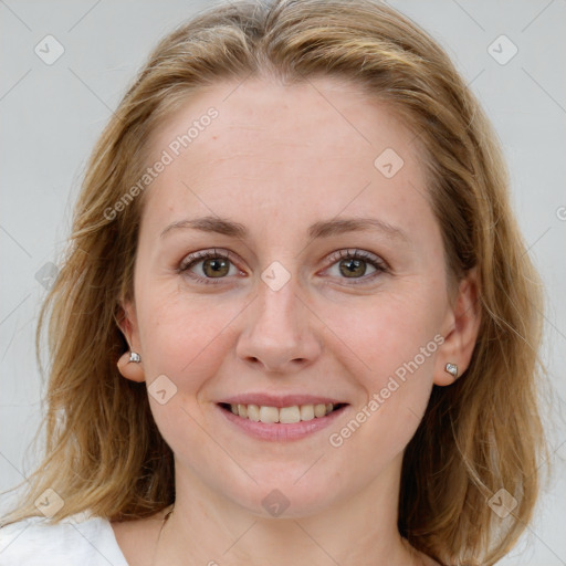 Joyful white young-adult female with medium  brown hair and blue eyes