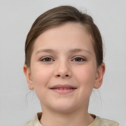 Joyful white child female with short  brown hair and brown eyes