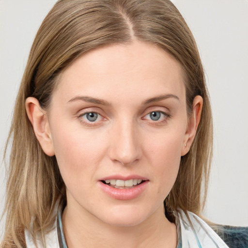 Joyful white young-adult female with medium  brown hair and blue eyes