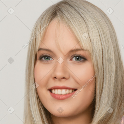 Joyful white young-adult female with long  brown hair and blue eyes