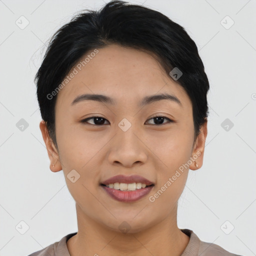 Joyful asian young-adult female with short  black hair and brown eyes