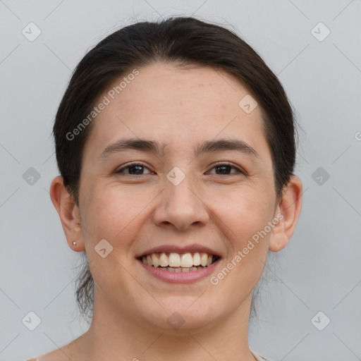 Joyful white young-adult female with short  brown hair and brown eyes