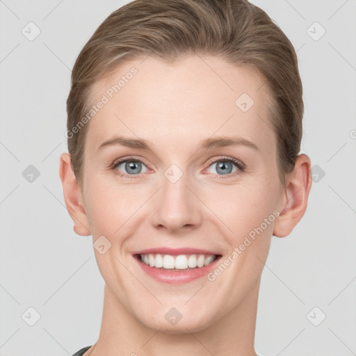 Joyful white young-adult female with short  brown hair and grey eyes