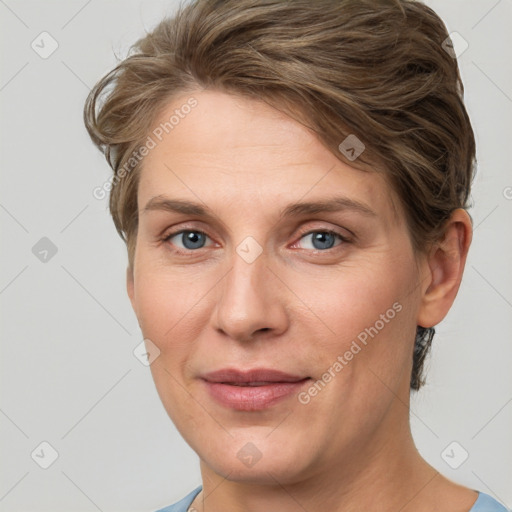 Joyful white adult female with short  brown hair and grey eyes