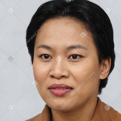 Joyful asian young-adult female with short  brown hair and brown eyes