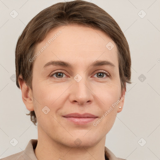 Joyful white young-adult female with short  brown hair and grey eyes