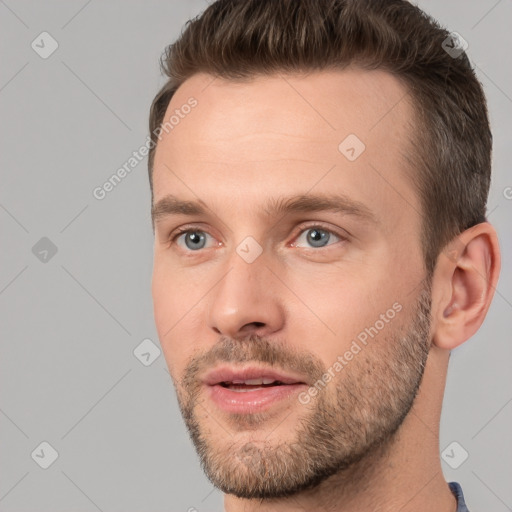 Joyful white young-adult male with short  brown hair and brown eyes