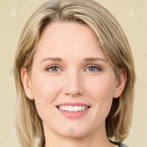 Joyful white young-adult female with medium  brown hair and green eyes