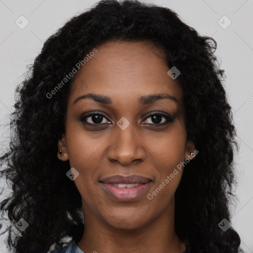 Joyful black young-adult female with long  black hair and brown eyes