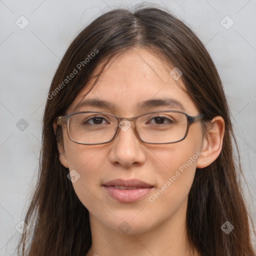 Joyful white adult female with long  brown hair and brown eyes