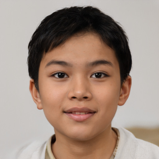 Joyful latino child female with short  brown hair and brown eyes