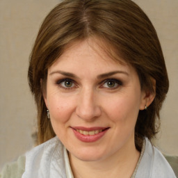 Joyful white young-adult female with medium  brown hair and brown eyes