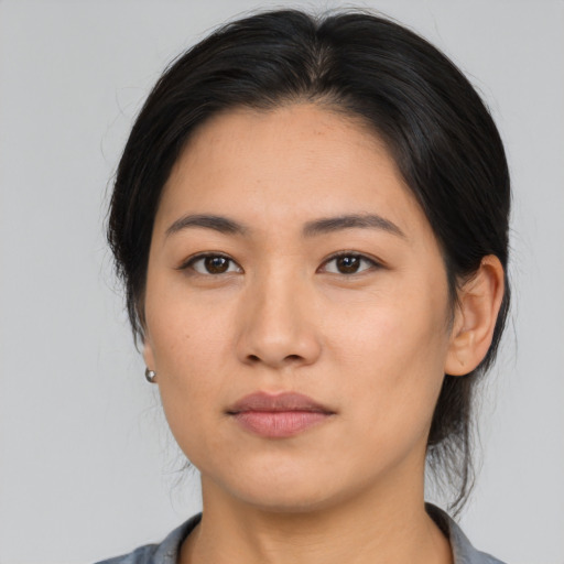 Neutral asian young-adult female with medium  brown hair and brown eyes