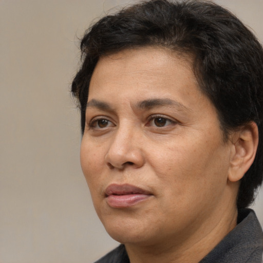 Joyful white adult female with short  brown hair and brown eyes