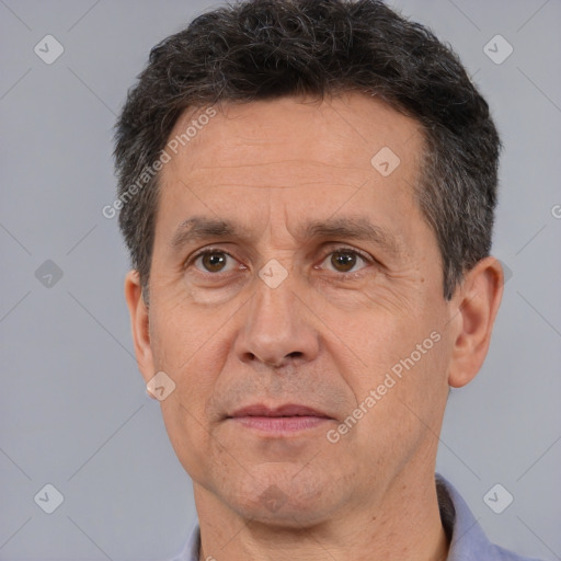 Joyful white middle-aged male with short  brown hair and brown eyes