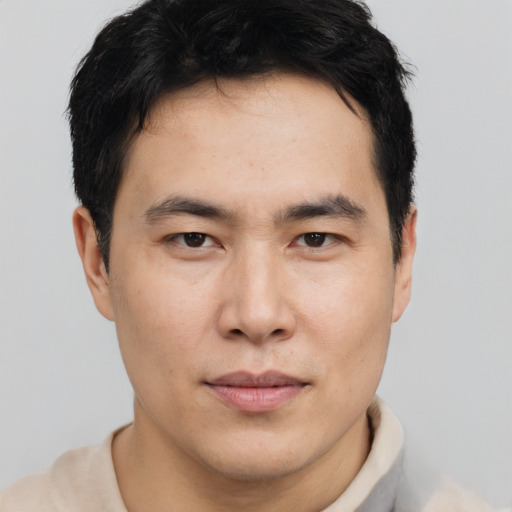 Neutral asian young-adult male with short  brown hair and brown eyes