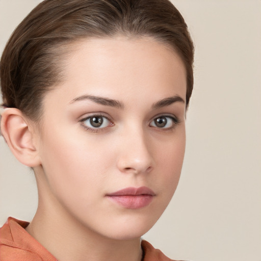 Neutral white young-adult female with short  brown hair and brown eyes