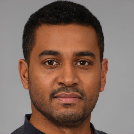 Neutral black young-adult male with short  brown hair and brown eyes