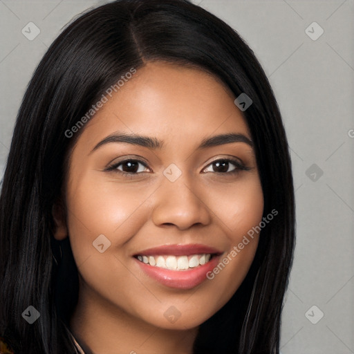 Joyful latino young-adult female with long  black hair and brown eyes