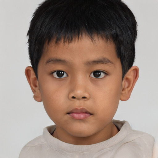Neutral asian child male with short  brown hair and brown eyes
