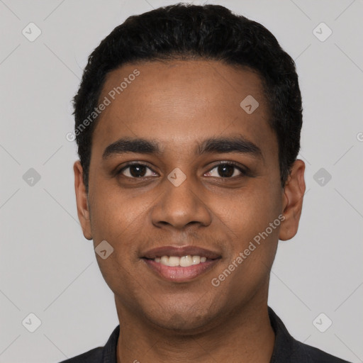 Joyful latino young-adult male with short  black hair and brown eyes