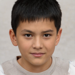 Joyful white child male with short  brown hair and brown eyes