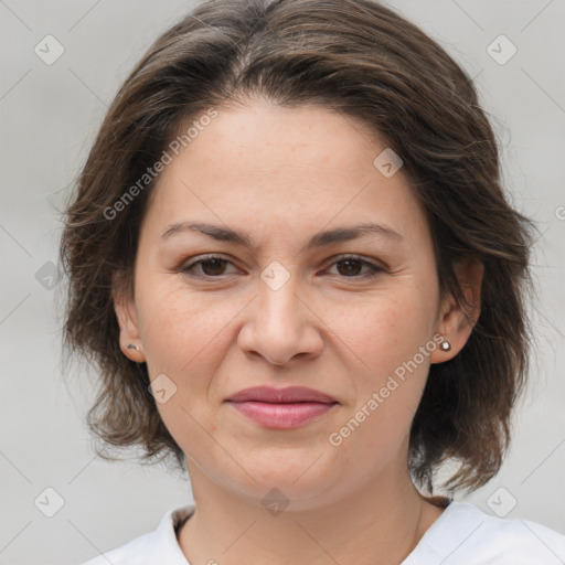 Joyful white adult female with medium  brown hair and brown eyes