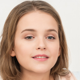 Joyful white child female with long  brown hair and brown eyes