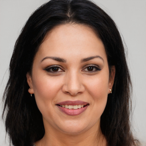 Joyful white young-adult female with long  brown hair and brown eyes