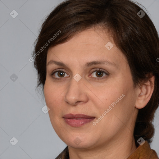 Joyful white adult female with medium  brown hair and brown eyes