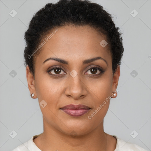 Joyful black young-adult female with short  brown hair and brown eyes