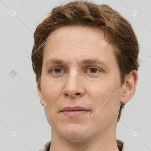 Joyful white adult male with short  brown hair and grey eyes