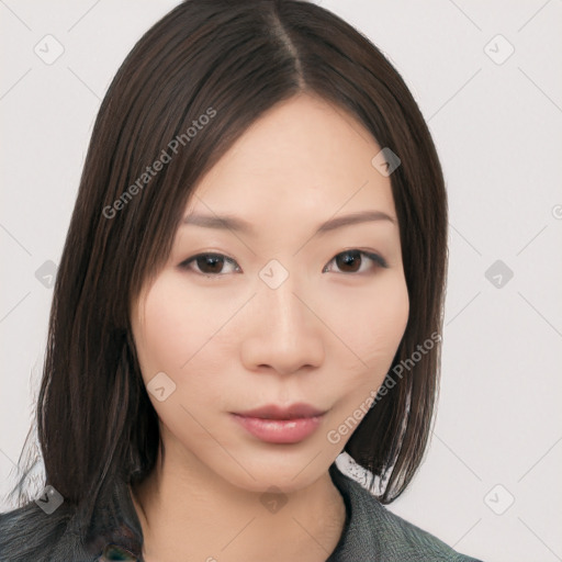 Neutral asian young-adult female with medium  brown hair and brown eyes