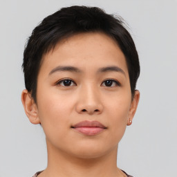 Joyful asian young-adult female with short  brown hair and brown eyes