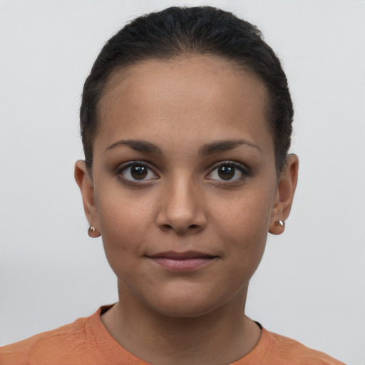 Joyful latino young-adult female with short  brown hair and brown eyes