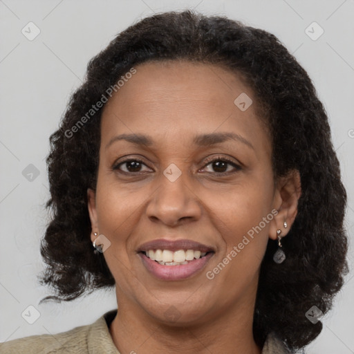 Joyful black adult female with medium  brown hair and brown eyes