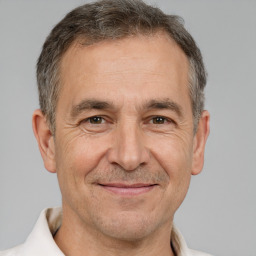 Joyful white middle-aged male with short  brown hair and brown eyes