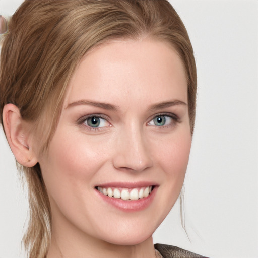 Joyful white young-adult female with long  brown hair and blue eyes