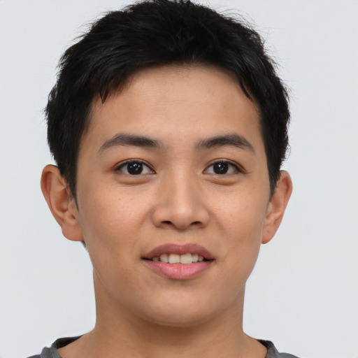 Joyful asian young-adult male with short  brown hair and brown eyes